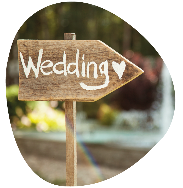wooden sign marked wedding with a heart